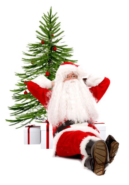 father christmas leaning on a xmas tree isolated over a white background