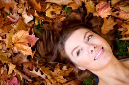 autumn girl portrait on the floor smiling