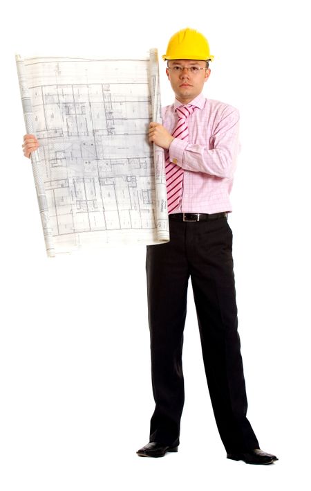 male architect with a yellow safety helmet holding some building plans - isolated over a white background