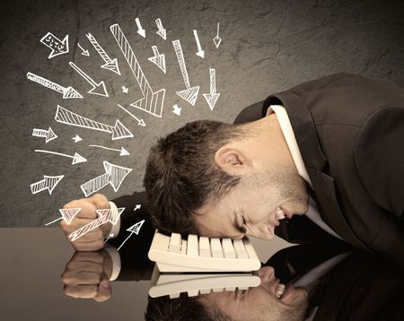 An exhausted business person resting his head on keyboard with pressure illustrated by arrows pointing at him concept