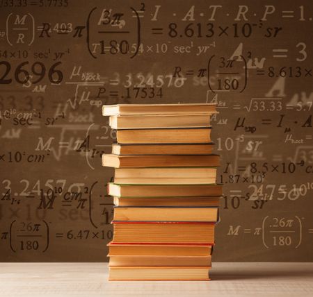 Books on vintage background with math formulas flying out