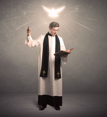 A holy priest reading a prayer from the holy bible with illustrated glowing angel above his head concept.