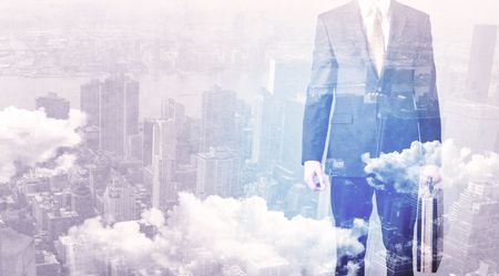 Business man standing at city overlay view background