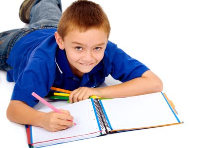 boy studying on the floor - isolated over a white background
