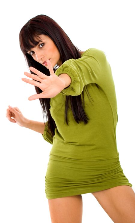fashion girl with hand in front of her signalling to stop - isolated over a white background