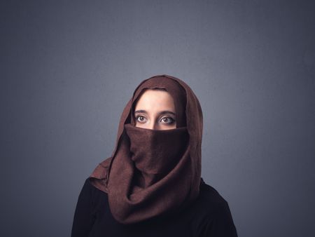 Young muslim woman wearing niqab