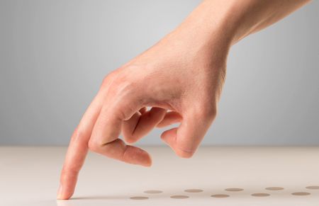 Female fingers walking with dots behind them