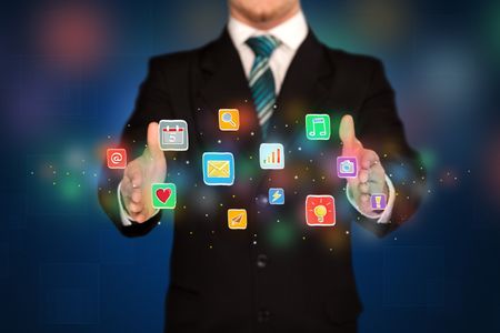 Elegant businessman holding colorful mixed media icons 