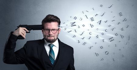 Man shoots his head with gun and letters are coming out from his head