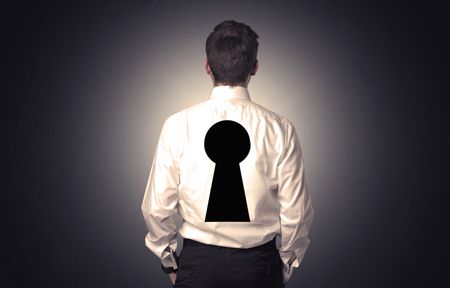 Young businessman standing and thinking with black keyhole on his back