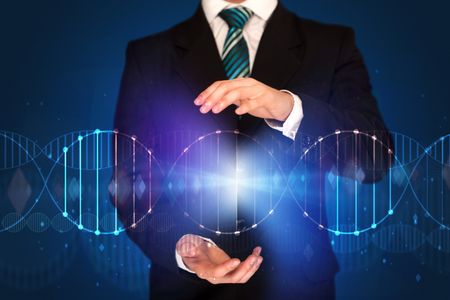 Businessman with DNA concept in his hands