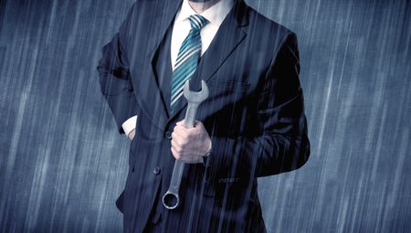 Young handsome  man holding tool with raindrop graphic