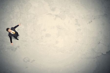 Business man from top standing with copy space desert background