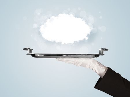 An elegant waiter business hand in white glove holding a plate with empty clear cloud in front of blue gradient background.