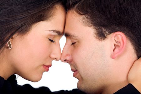 couple freaming together with eyes closed and facing each other - isolated over a white background