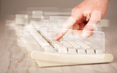 Hand touching keyboard with high tech button screen