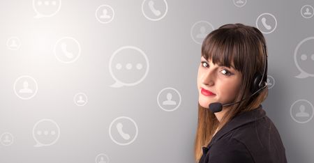 Young female telemarketer with white speech bubbles around her