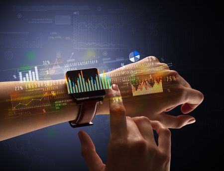 Cloe up naked female hand with smartwatch with financial symbols around