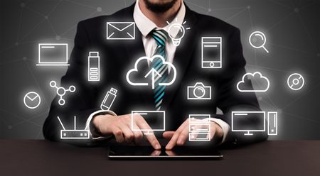 businessman-suit-typing-multimedia-concept-684131785 Businessman in suit typing with multimedia concept above