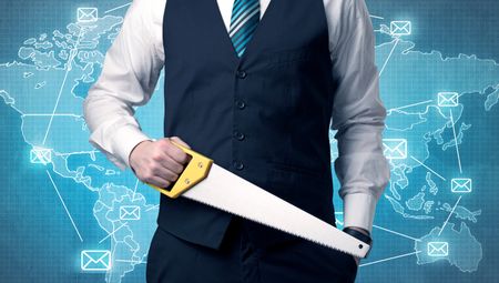 Businessman holding tool with global map graphic on the background