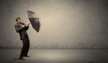 handsome-business-man-holding-umbrella-copy-686533147 Handsome business man holding umbrella with copy space background concept