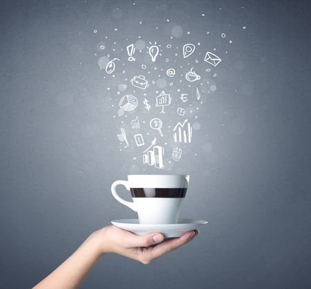 Young female hand holding coffee cup with business related drawings above it 