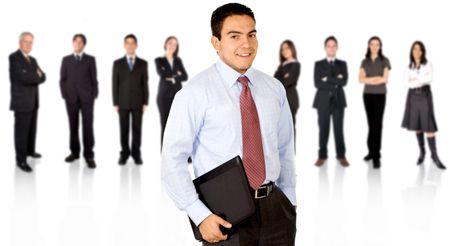 Business team in an office with a businessman leading