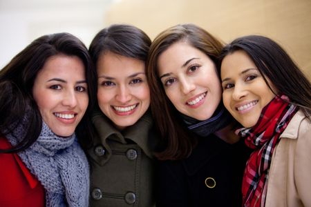 Group of women wearing warm clothes and smiling