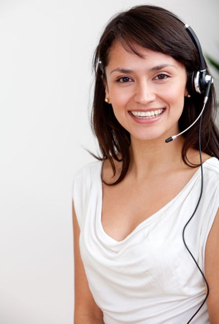 Female customer support operator with headset smiling
