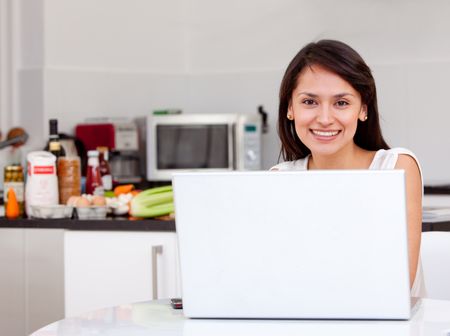 Woman working at home on a laptop computer