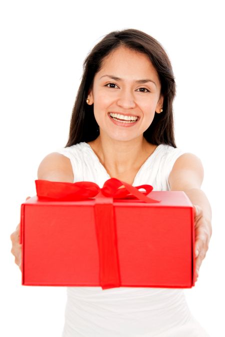 Woman holding a red gift - isolated over a white background