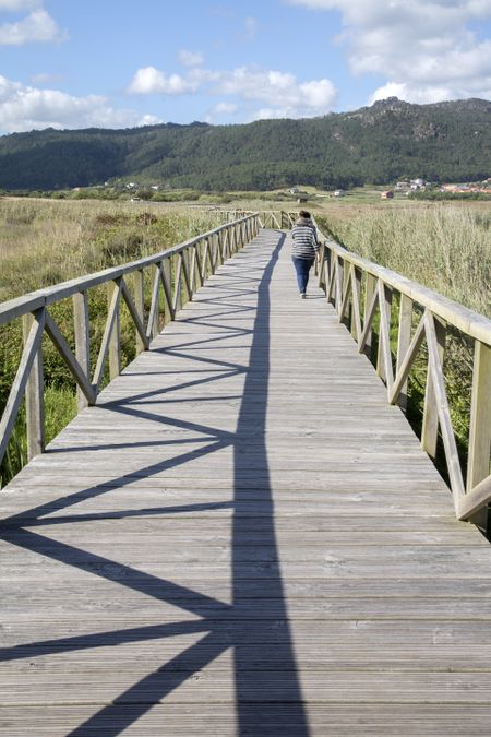 Young Woman on Walkway at Beach; Spain