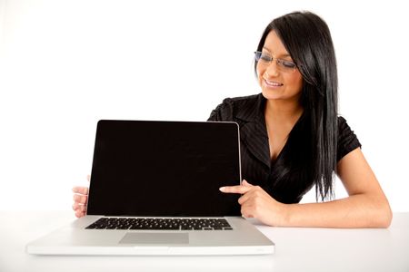 Business woman pointing on a laptop screen ? isolated