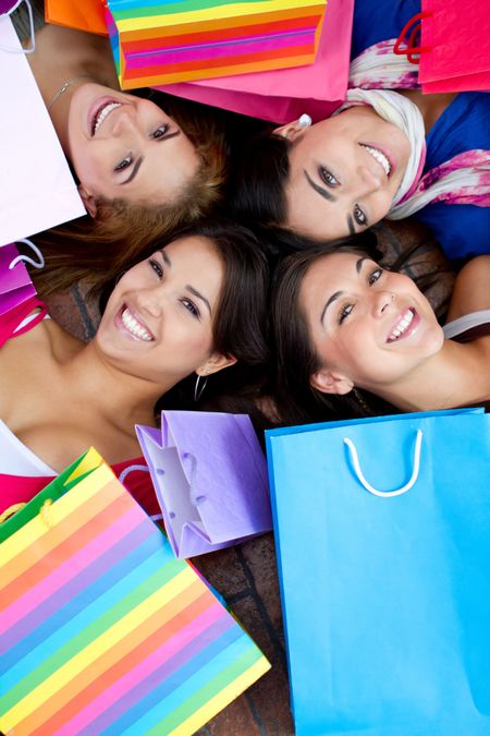 Beautiful shopping women with bags and smiling