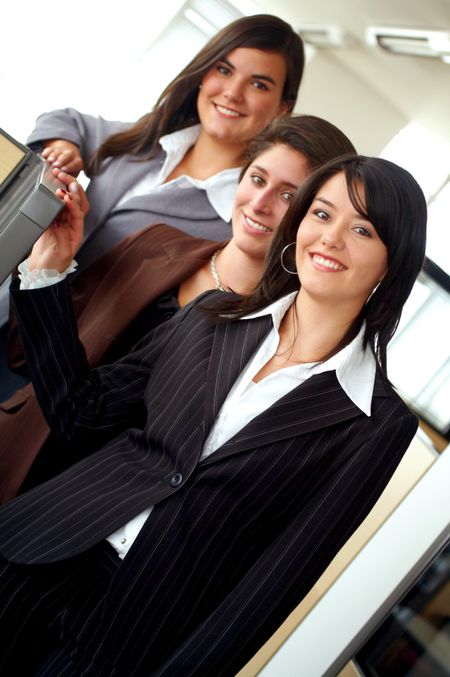 business female team portrait in an office environment - all looking friendly and smiling