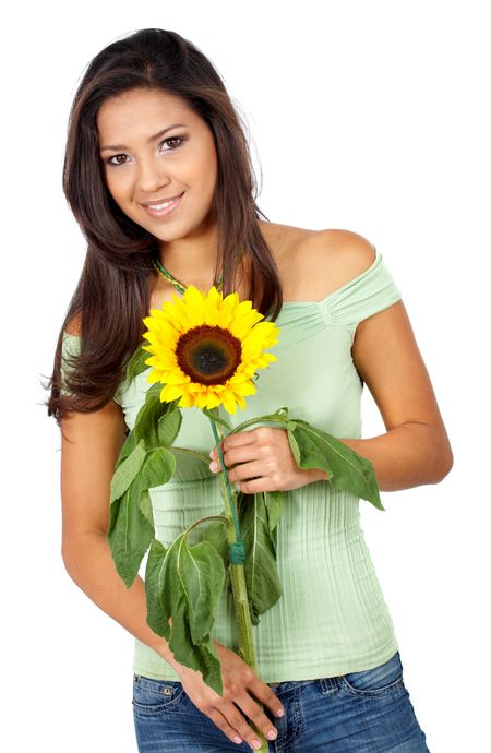 casual girl smiling and holding a sunflower - isolated over a white background