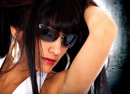 fashion woman portrait wearing sunglasses facing the camera