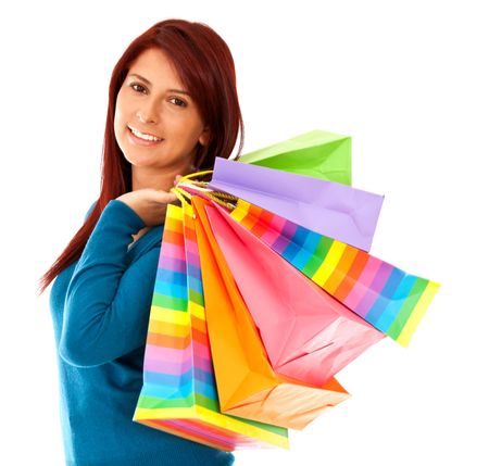 Shopping woman holding bags - isolated over white