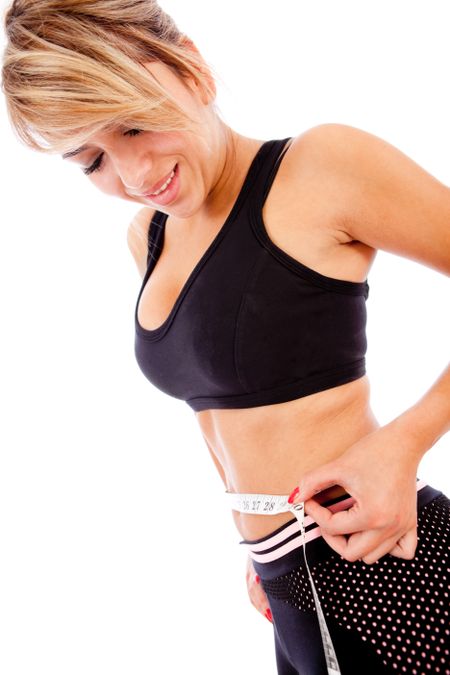 Fit woman measuring her waist  lose weight concepts