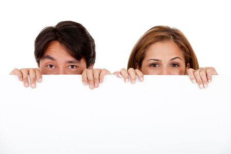 Couple holding a banner and hiding half their face - isolated