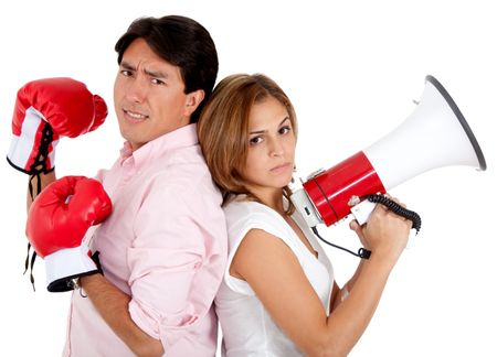 Man with boxing gloves and woman with megaphone ready for a couple's fight ? isolated