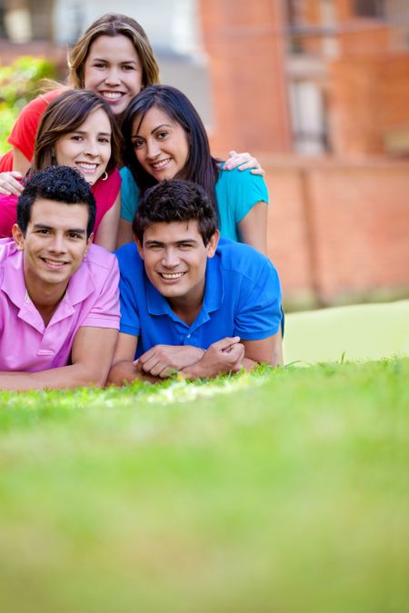 Happy group of casual friends smiling outdoors