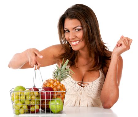 Healthy eating woman with a basket of fruits ? isolated over white