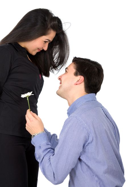 man offering a flower to his girlfriend - isolated over a white background