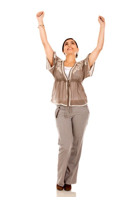 Happy business woman with arms up - isolated over white