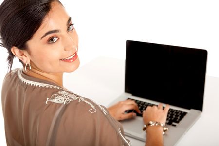 Business woman working on a laptop computer  isolated