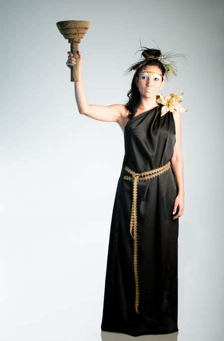 Beautiful dark Greek goddess holding a torch
