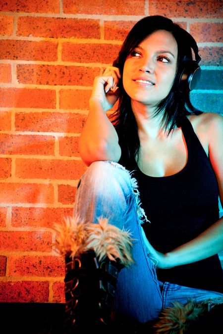 rock-style-woman-headphones-listening-music-71828926 Rock style woman with headphones listening to music