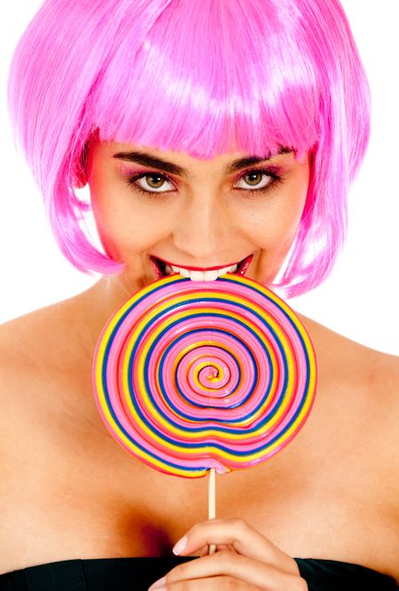 Girl with a pink wig biting a lollipop - isolated