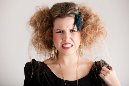 Portrait of a disgusted woman with messy hairdo